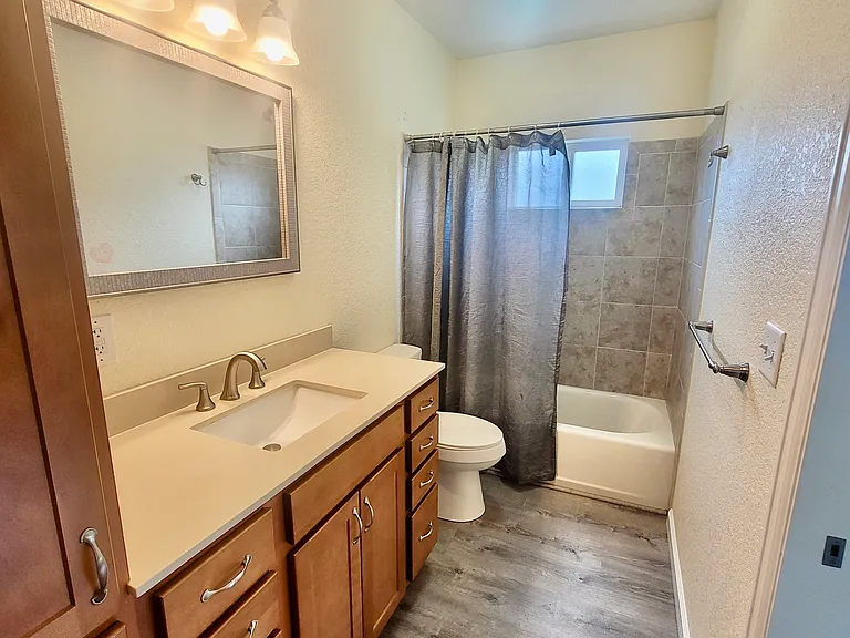 bath with entry from Master bedroom and main living space