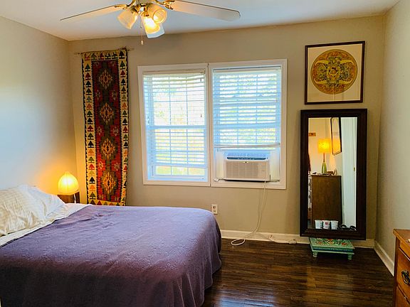 Spacious bedroom features hardwood floors, large walk in closet & whisper-quiet window AC unit.