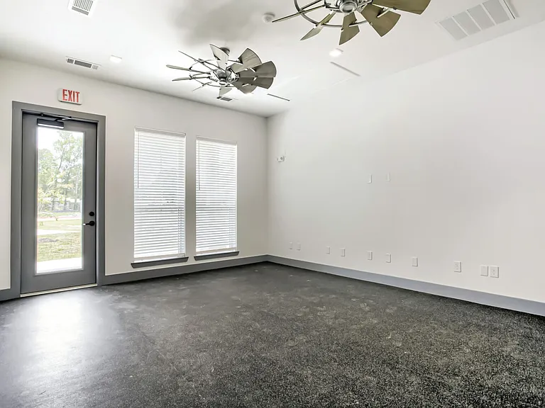 fitness center with door to outside