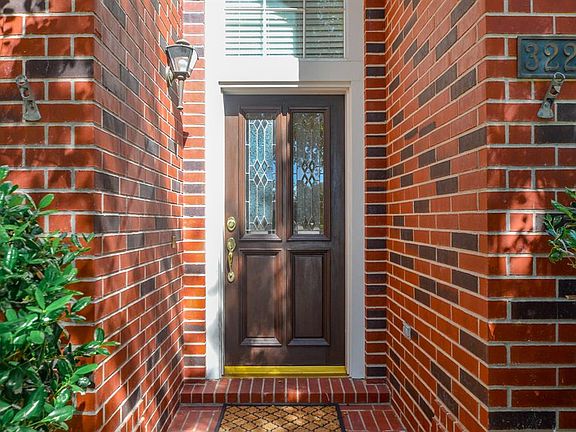 Welcoming covered brick entry.