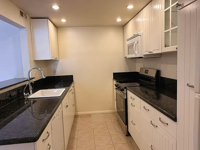 Updated kitchen with granite countertops and brand-new stove