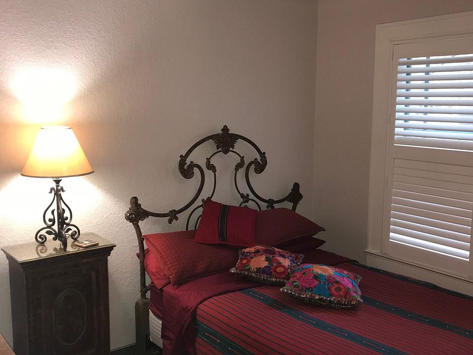 Middle bedroom, double iron bed, Guatemalan bedspread and pi