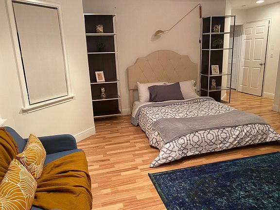 Master bedroom with attached bathroom. Queen size bed.