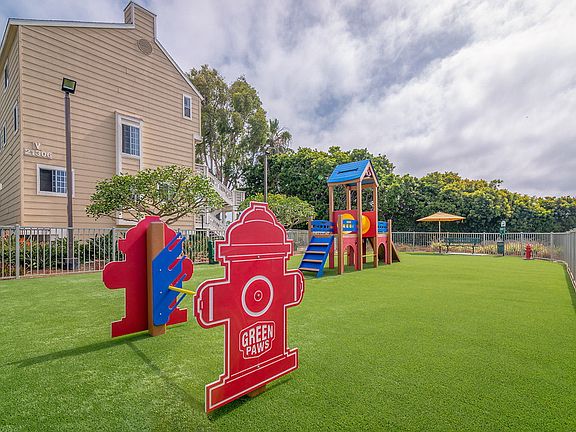 Gated dog park with playground.