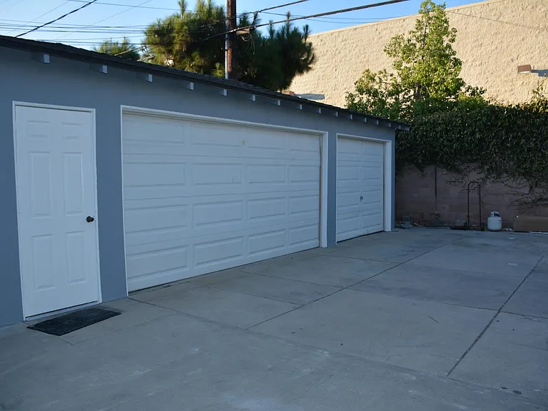 The larger private garage goes with this unit.