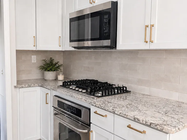 Kitchen with granite countertops, stainless appliances, gas cooktop, and plenty of counter space