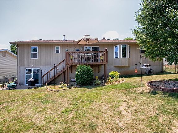 Look at those beautiful wood floors!!! Vaulted ceiling, ceiling fan, woodburning fireplace... there's a dining room area that op