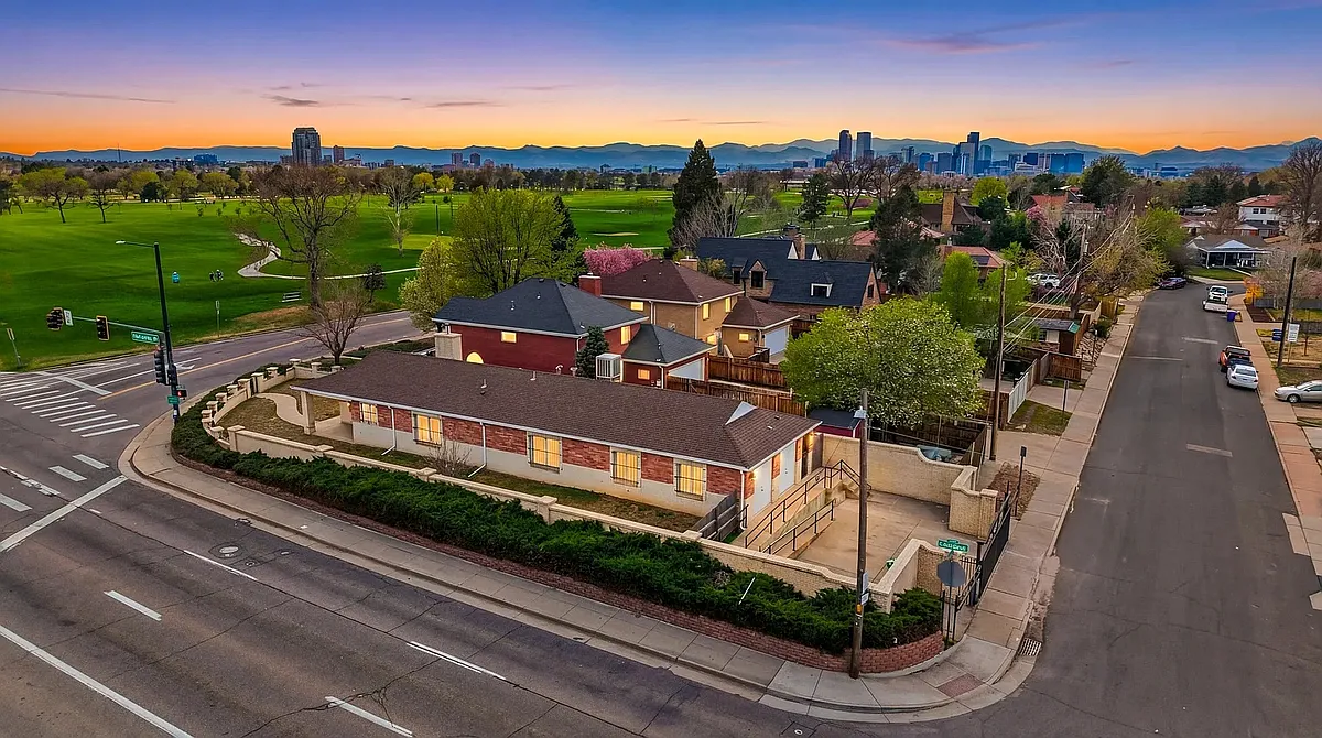 Drone view showing city park golf course & downtown denver in the distance. - 3921 E 26th Avenue Pkwy