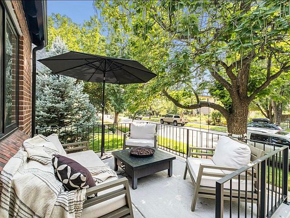 New extra large front patio overlooking the 100 year old trees.
