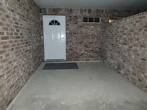 Outside facing north looking at front covered entrance