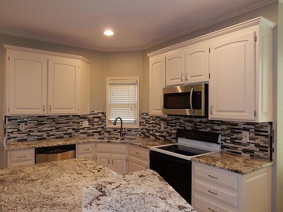 Full granite Great kitchen space Now a 6 burner gas stove