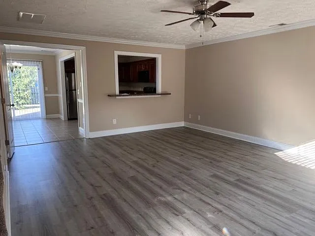 Living area with LVP flooring. Open and spacious floor plan