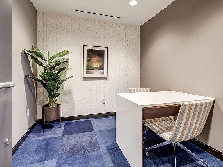 Modern conference room with stunning light fixtures and a TV