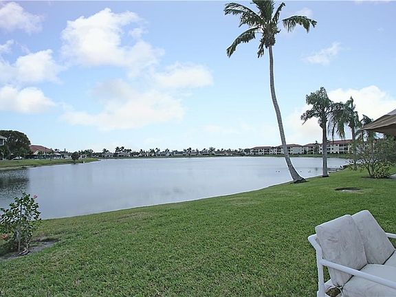 View from patio of lake.   Note that main clubhouse is at left center at curve on the bank.