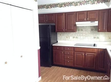 kitchen : The white doors to the left are where the washer and dryer (included) are kept.