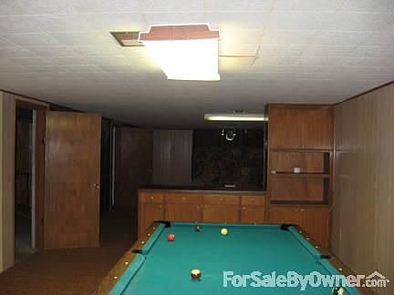 Finished basement with bar/pool table
						:
						Large entertaining areas with pool table included in sale and large storage area