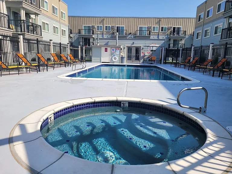 Sunset Apartments | Outdoor Seasonal Pool + Hot Tub
