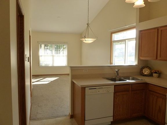 Open floor plan, living room/dining room feature a vaulted ceiling!