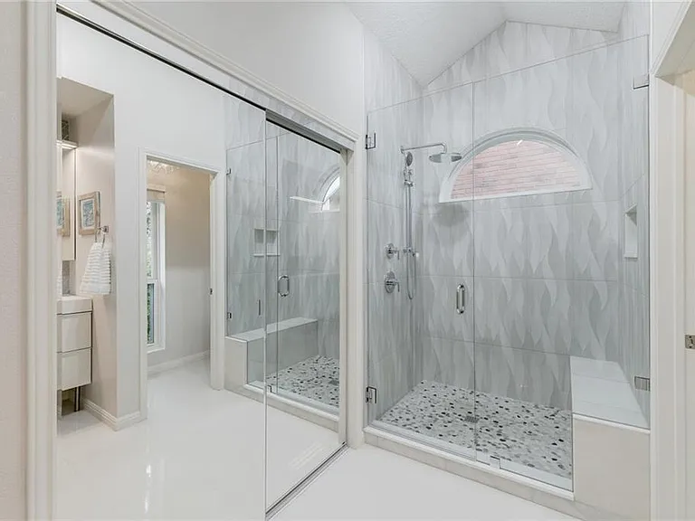 Primary bathroom with large shower and large closet.