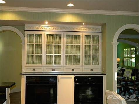 Notice the arched doorways.  There is a great amount of cabinet and counter space in the kitchen