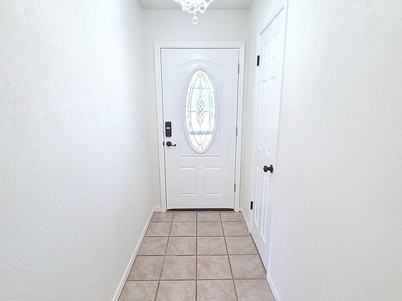 Main Entrance with Keypad Lock and Large Storage Closet