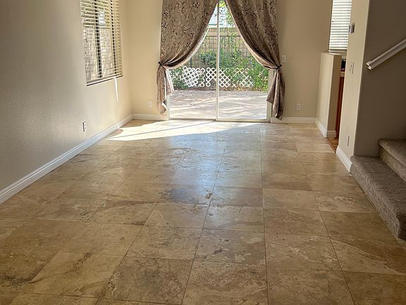 Formal Living room and formal dining room; travertine tiles throughout and freshly painted