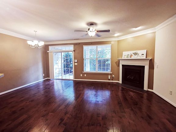 Open Concept living room with glassdoor to back patio