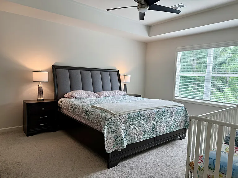 Primary bedroom with tray ceiling