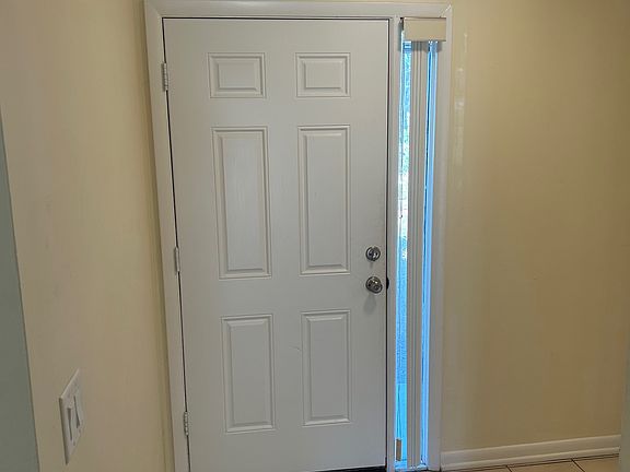 Downstairs looking at front door entry