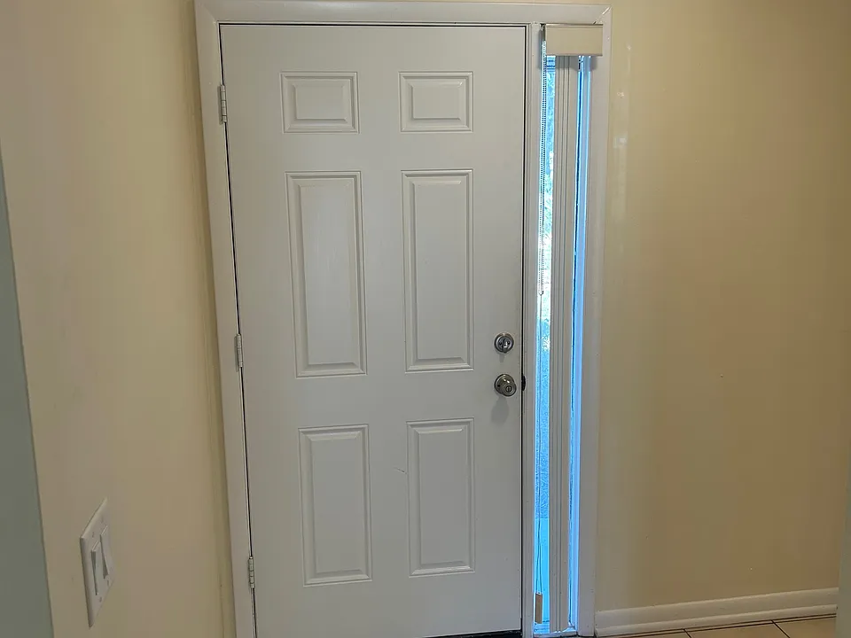 Downstairs looking at front door entry