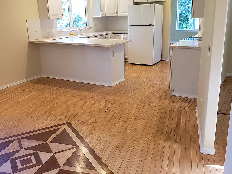view to kitchen from family room