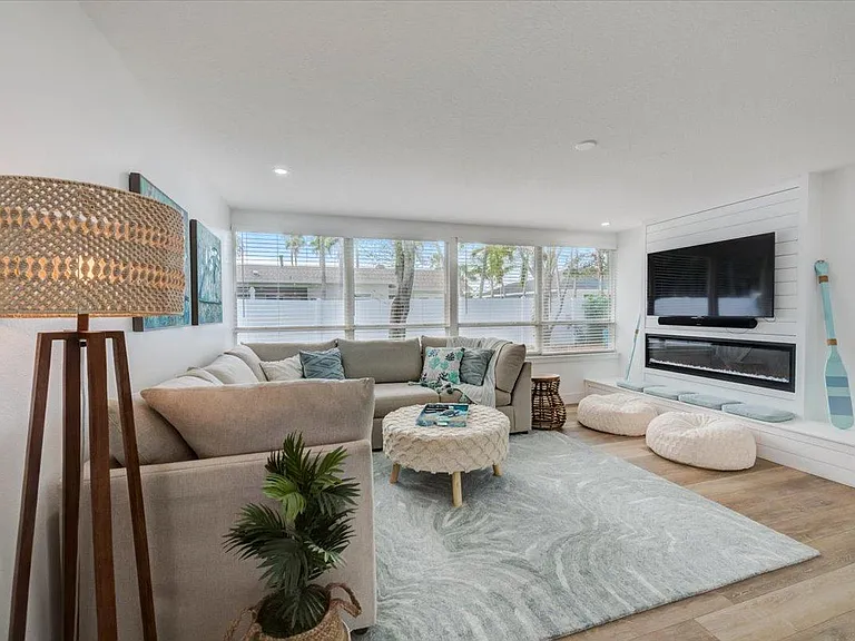 The evening hangout spot! Super cozy living room. 60'' smart tv. 
Shiplap Fireplace for ambiance.