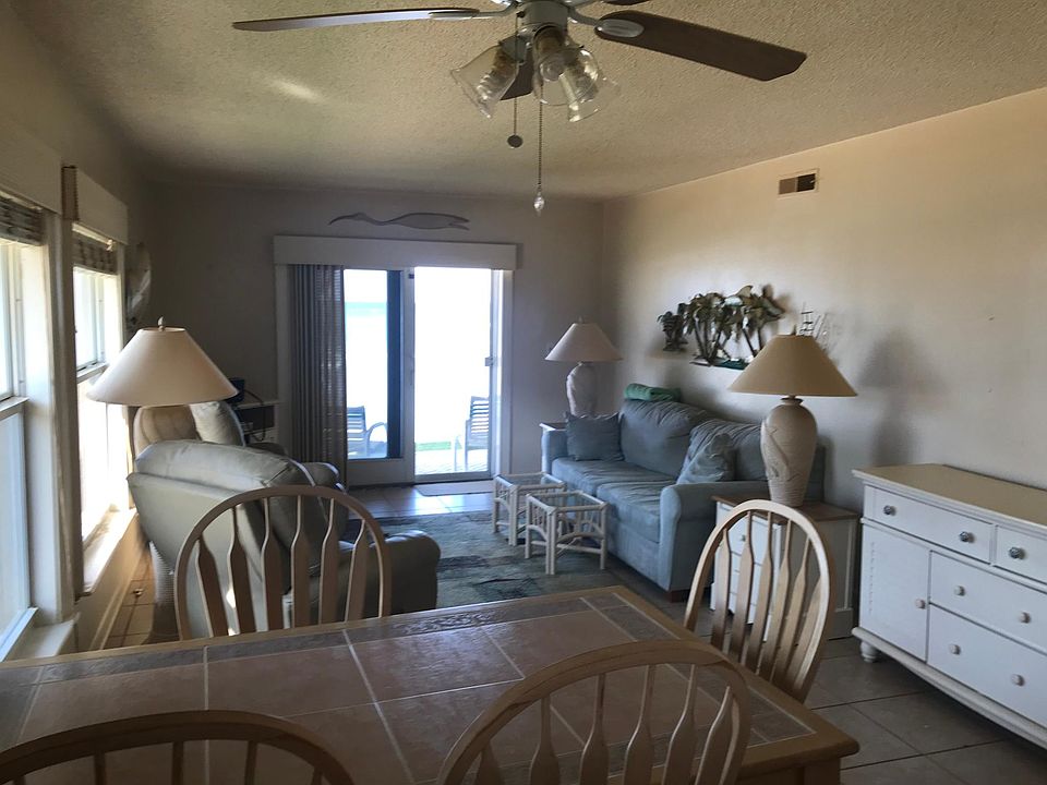 Living dining view from kitchen. Stools available