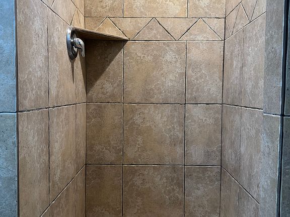 Beautifully tiled shower in the bathroom