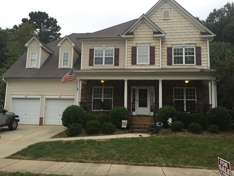 Large front porch w swing and stone face