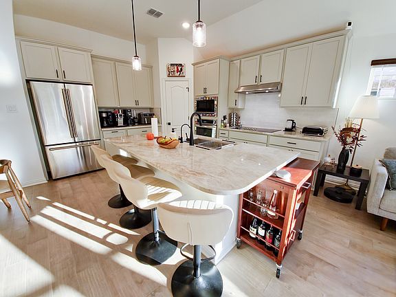 Fully-equipped kitchen with modern cabinets, aesthetically matching