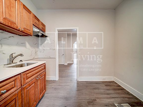Kitchen includes a stove and fridge