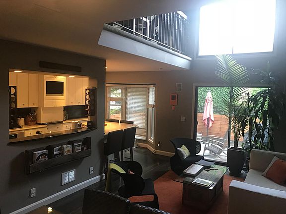 Living room with doors out to newly, renovated private patio