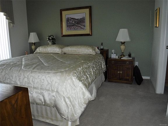 Master bedroom with sliding glass door to patio