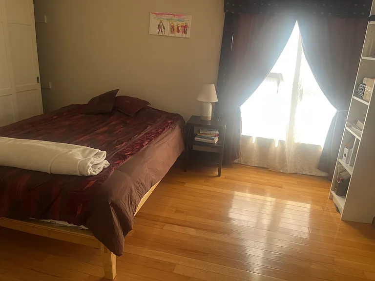 2nd bedroom - comes with blackout curtains and brand new queen-sized bamboo bed frame