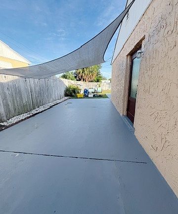 Side of house fenced in parking