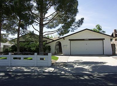 Lush front yard with mature trees