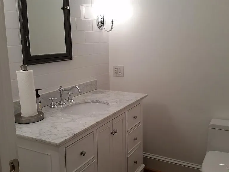 Powder Room with Dual Flush toilet and stone counter top