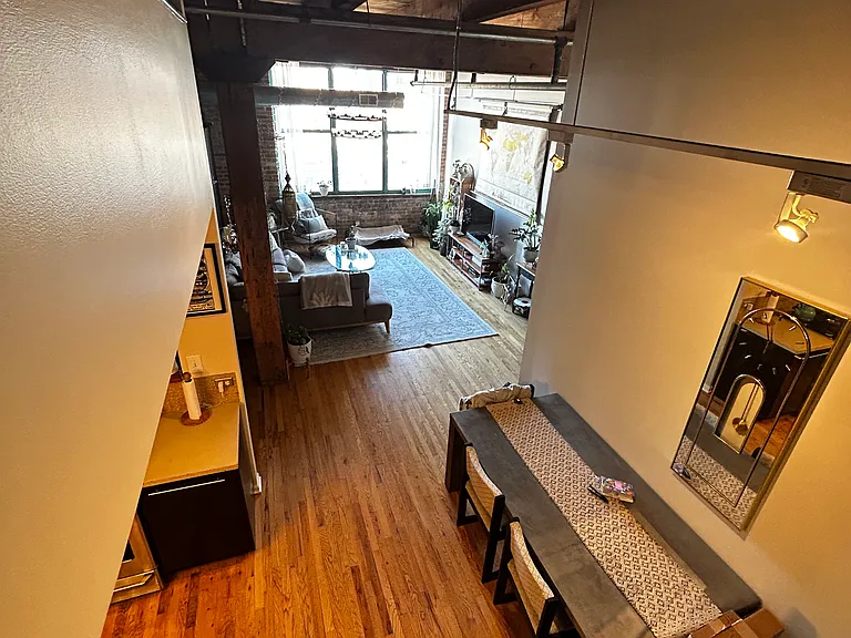 View from the top of the loft ladder, overlooking the dining room and living room