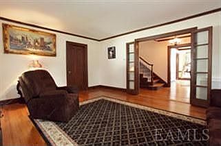 Living Room with Double French Doors into Foyer.