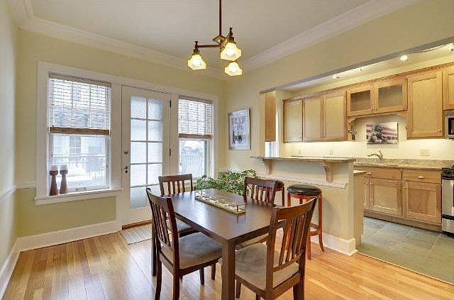 LARGE DINING ROOM OPENS TO KITCHEN AND LEADS TO THE OUTDOOR BALCONY.