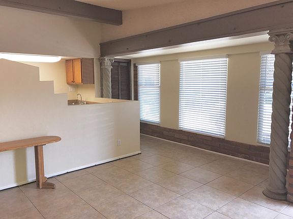Another View of the Living Area Facing North. Nice 18" Ceramic Tile Throughout the Home. (Photo taken before addition of Breakfast Bar)