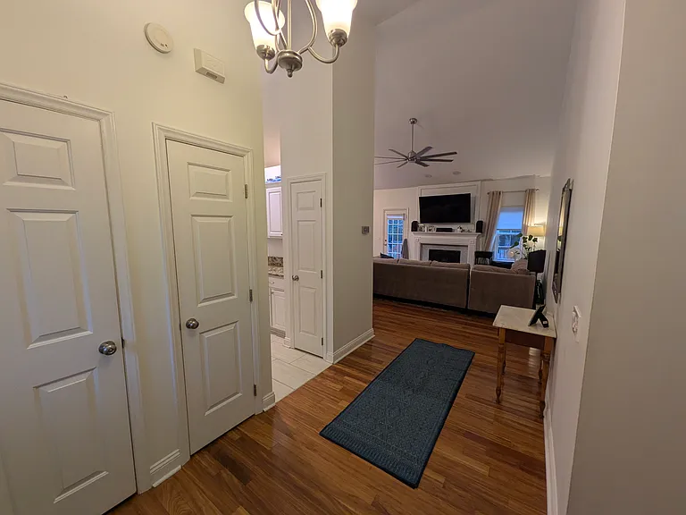 Entryway
Provides easy access to the home's main living spaces. The FROG is located through the 1st door on the left, the kitchen is to the left, and the living room is straight ahead. The hallway to the right leads to the main suite and 2 guest bedrooms.
