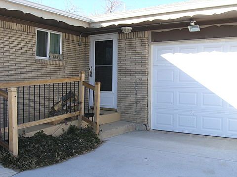 Front of house with handicap accessible ramp
