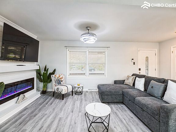 Stylish Living Room w/ Fireplace and exclusive light fixture